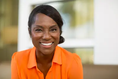 African woman in orange