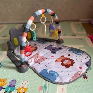 Comfort baby play mat with a musical piano gym
