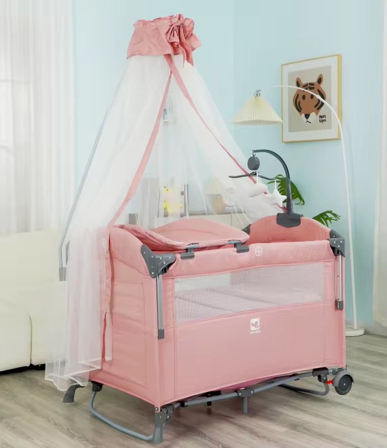 Pink baby playpen with changing table, stand net, rocking mode and musical toys Pink baby playpen with changing table, stand net, rocking mode and musical toys