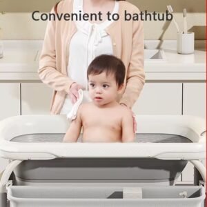 Baby bath and changing station with foldable basin , height adjustable with temperature sensor
