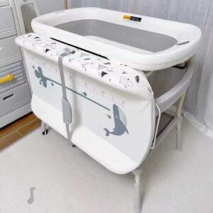 Baby bath and changing station with foldable basin , height adjustable with temperature sensor