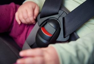 child-in-car-seat-showing-buckle-and-harness